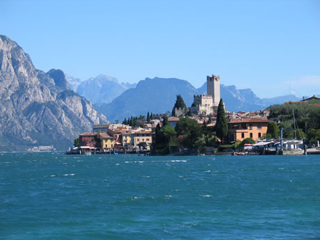 Malcestine with the historic castle of skaligers on Garda lake photo