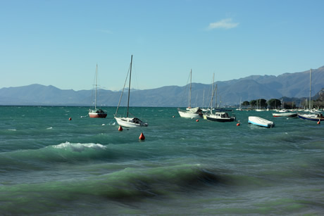 Mountains boats and lake Garda photo